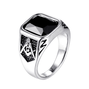Macro detail of men's Freemason ring with rectangular black onyx and engraved silver band