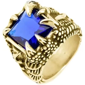Close-up of golden dragon claw ring holding a square blue gemstone with scale details