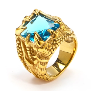 Detailed view of men's golden dragon scale ring with square blue gemstone centerpiece