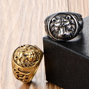 Lion head rings in gold and silver steel with detailed carvings and ornate patterns