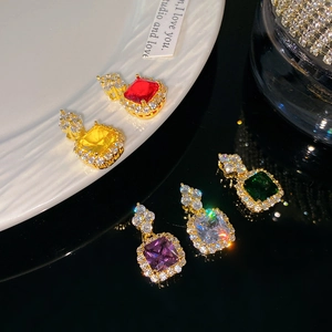 Elegant gold necklace with geometric square colorful zircon pendants in a vintage style