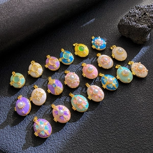 Detailed grid display of vintage enamel pendants with colorful stones and gold plating