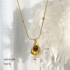 Vintage gold tiger eye stone pendant necklace with brown teardrop gemstone and snake chain