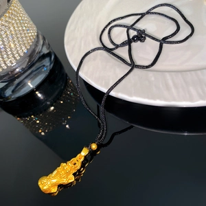 Gold-plated Pixiu pendant necklace with sandblasted finish on black woven cord