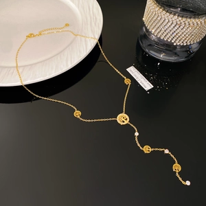 Detailed view of 18K gold-plated Tree of Life Y-necklace with sparkling zircon accents