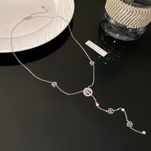 Silver tree of life Y-necklace featuring cubic zirconia accents and fringe pendant detail