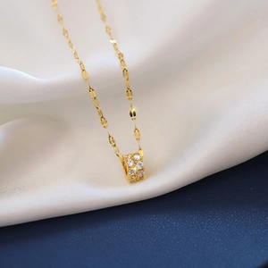 Elegant gold titanium steel necklace featuring a cylinder pendant with double row zircons