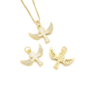 Golden angel wing Ankh necklace with opal stones and zircons on white background