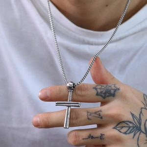 Men's silver punk baseball cross necklace in stainless steel on a model