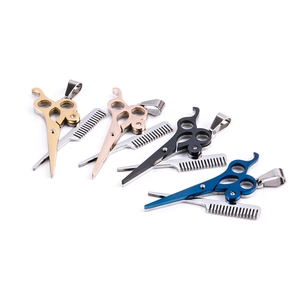 Detailed view of punk scissors and comb pendants in gold, rose gold, blue, and black finishes