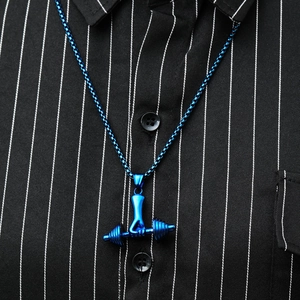 Detail of blue electroplated dumbbell pendant on a steel box chain for men's fitness