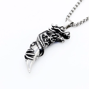 Retro stainless steel dragon tooth pendant with detailed scales on a box chain