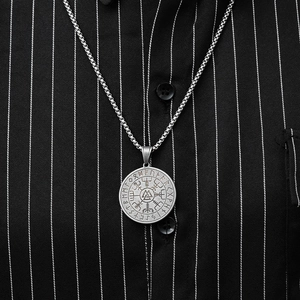 Detail of vintage Viking Valknut pendant with Nordic runes on a silver chain