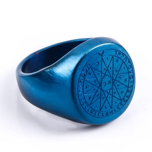 Detailed view of blue brushed stainless steel signet ring with Solomon star engraving