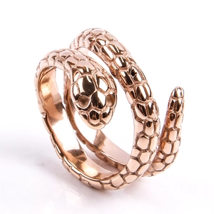 Macro detail of rose gold snake ring showing intricate scale textures and openwork head