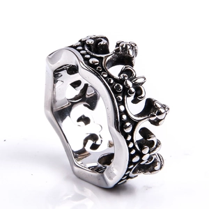 Close-up of vintage stainless steel crown ring with detailed retro blackened finish