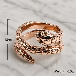 Rose gold stainless steel snake ring with textured scales and adjustable open design