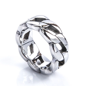 Macro detail of silver stainless steel Cuban link ring with vintage textured finish