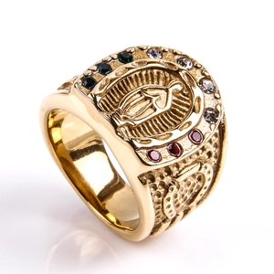 Macro detail of gold Saint Mary ring with multicolor zircon stones and horseshoe frame