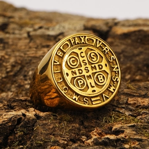 Vintage gold Saint Benedict Medal signet ring in stainless steel on natural bark base