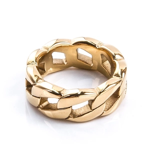 Macro view of polished gold stainless steel curb link ring with a smooth mirror finish