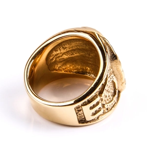 Detail view of gold hip hop ring showing the textured side engraving and inner band finish