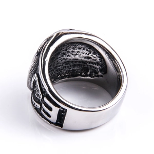 Detailed side view of vintage stainless steel hip hop ring with textured engravings