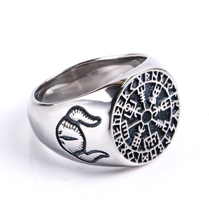 Macro shot of silver Viking Vegvisir compass ring with vintage feather side textures