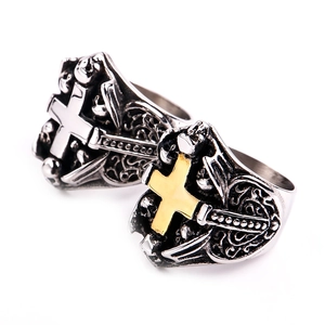 Macro detail of gothic biker ring with skull and cross pattern in vintage steel finish
