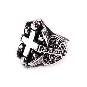 Detailed close-up of gothic skull and cross motifs on vintage stainless steel ring