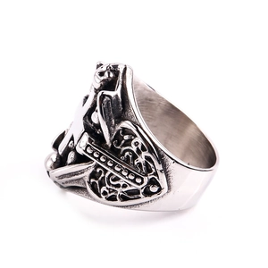 Detailed view of silver vintage gothic ring featuring cross and filigree engraving