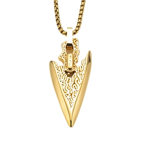 Detail of vintage gold arrow pendant featuring embossed patterns and polished finish