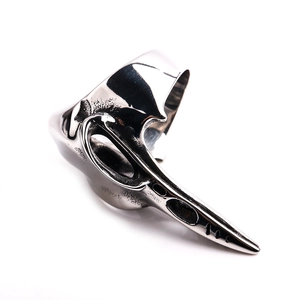 Macro view showing the polished raven skull ring with vintage gothic metal details