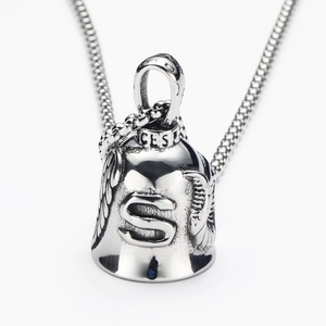 Detailed macro view of retro stainless steel eagle wing bell pendant with S engraving