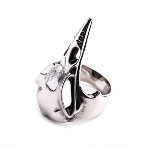 Vintage steel bird skull ring for men with gothic oxidized finish on white background
