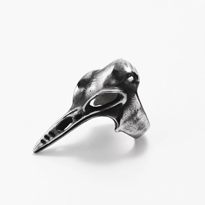 Macro detail of gothic stainless steel raven skull ring with vintage silver oxidized finish