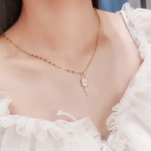 Minimalist gold lock and key pendant necklace with sparkling zircon stones for women