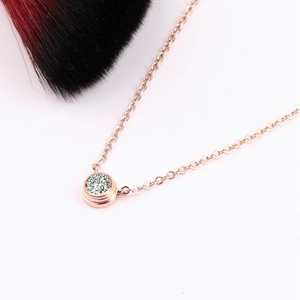 18K rose gold necklace featuring a brilliant round solitaire pendant in bubble setting