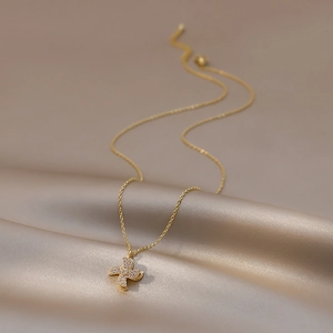 Rotating four-leaf clover windmill necklace with sparkling crystals on gold chain