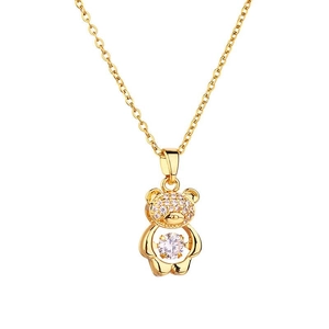 Golden bear necklace with sparkling pink crystals and dancing clear stone on white background