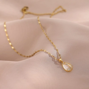 Elegant gold tulip pendant necklace with mother of pearl and small diamonds on pink silk