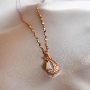 Rose gold tulip flower necklace with white shell pendant and sparkling zircon accents
