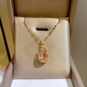 Elegant gold tulip necklace featuring a water-drop pink crystal pendant on a gift box
