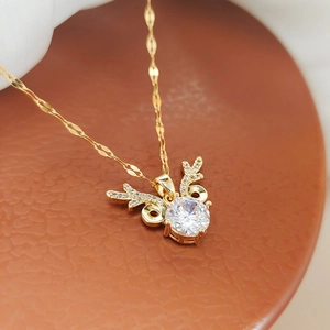 Golden titanium steel reindeer necklace with large zircon stone and pavé antlers