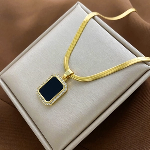 Elegant gold snake chain with black rectangular pendant and zirconia border