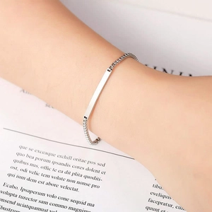 Minimalist silver titanium steel bar bracelet with polished box chain on woman's wrist