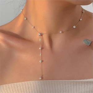 Elegant Y-shaped gold necklace with white pearls and sparkling crystals for women