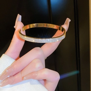 Elegant gold-plated double-row zircon hinged bangle bracelet with minimalist luxury design