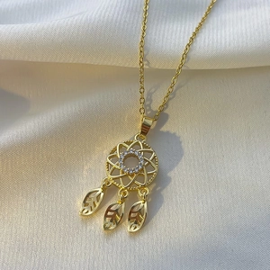 Golden dreamcatcher necklace with white zircon pavé and hollow feathers on silk