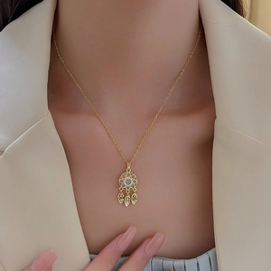 Gold plated titanium steel dreamcatcher necklace with white stone and leaf pendants